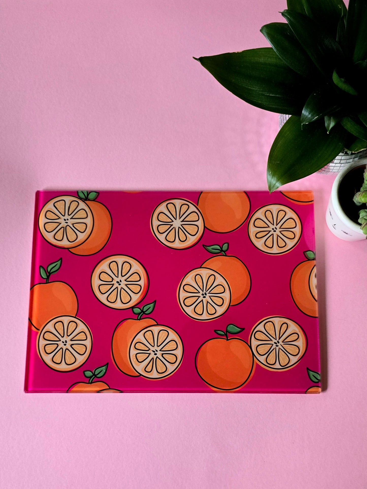 Fruity Oranges On Pink Glass Chopping Board