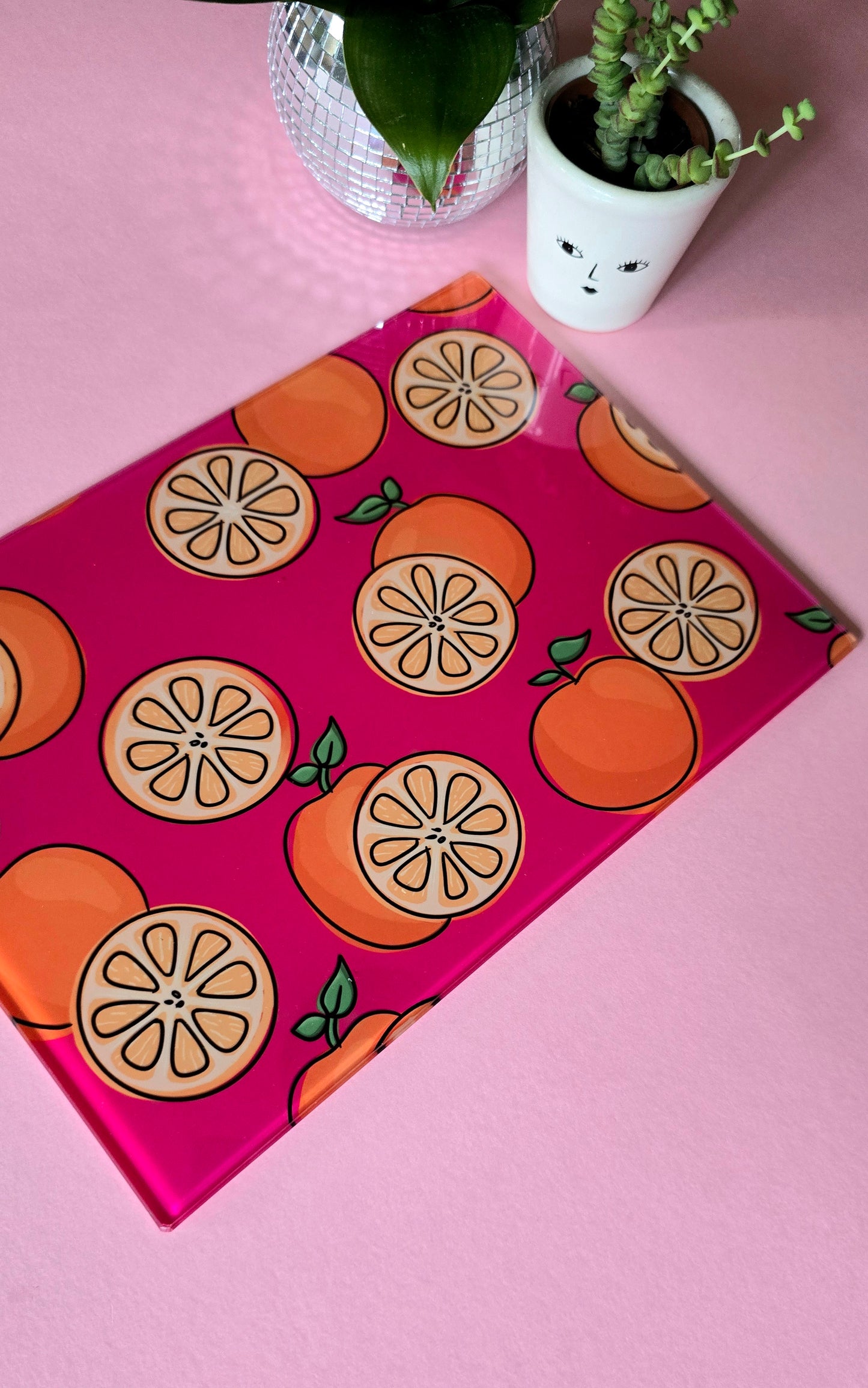 Fruity Oranges On Pink Glass Chopping Board
