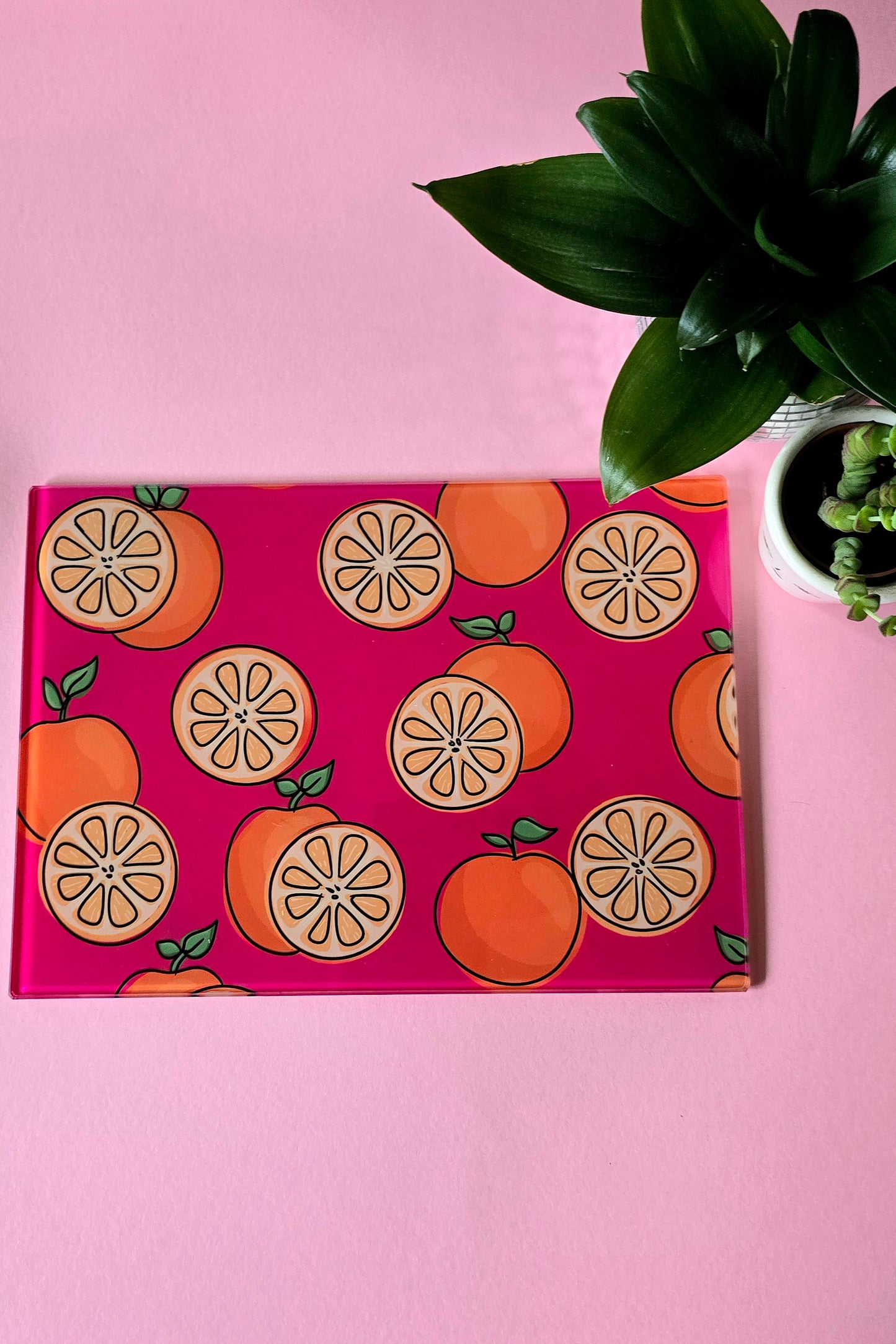 Fruity Oranges On Pink Glass Chopping Board