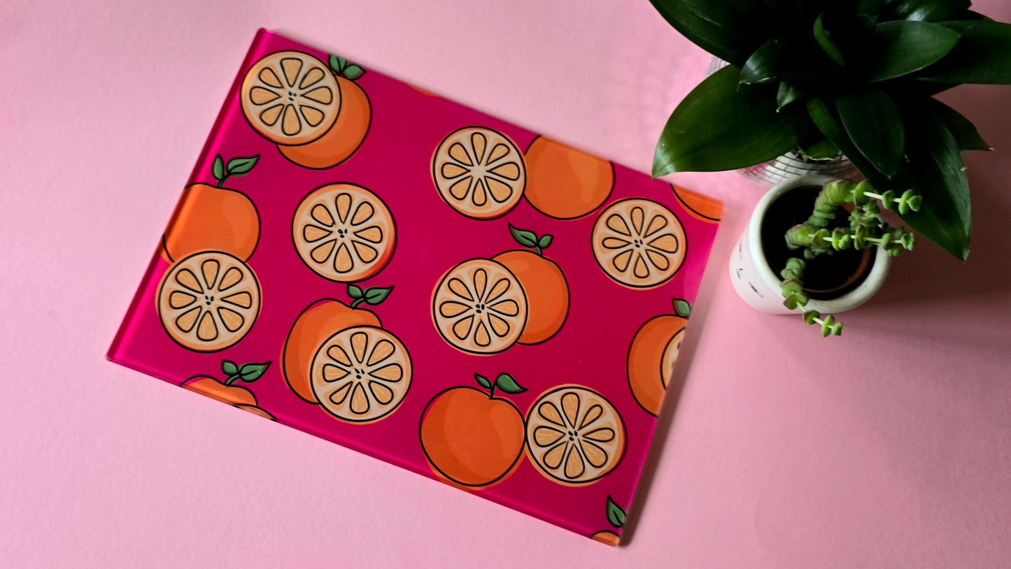 Fruity Oranges On Pink Glass Chopping Board