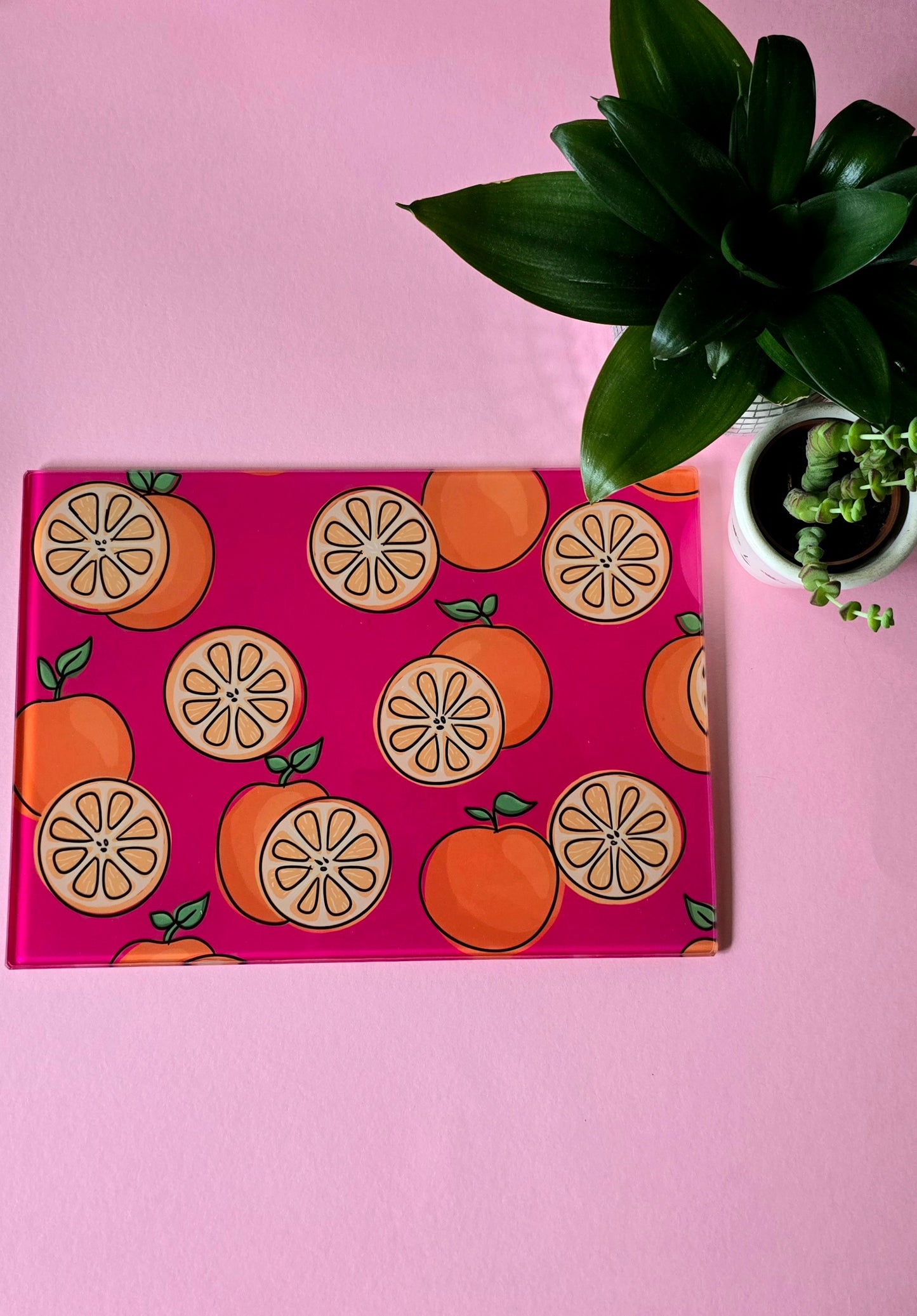 Fruity Oranges On Pink Glass Chopping Board