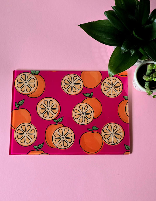 Fruity Oranges On Pink Glass Chopping Board