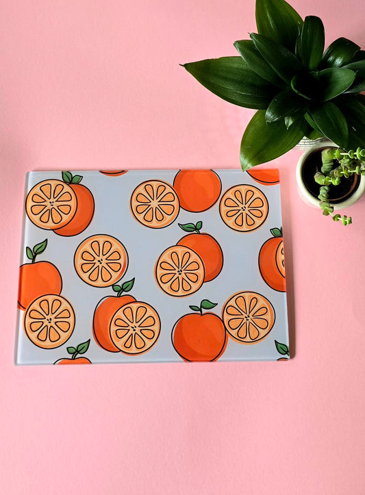 Fruity Oranges On Blue Glass Chopping Board